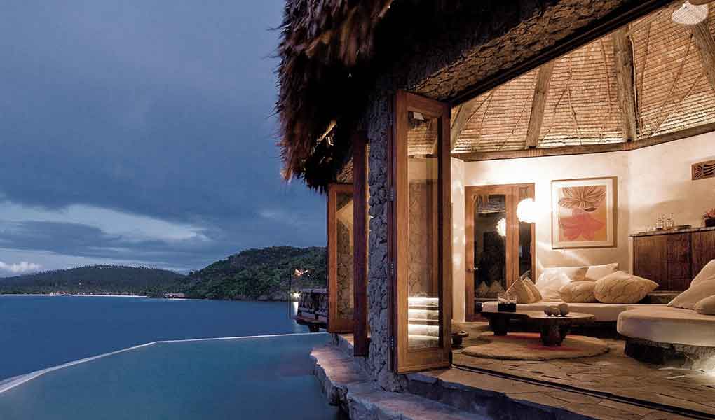 Villa privada con iluminación nocturna en COMO Laucala Island Fiji